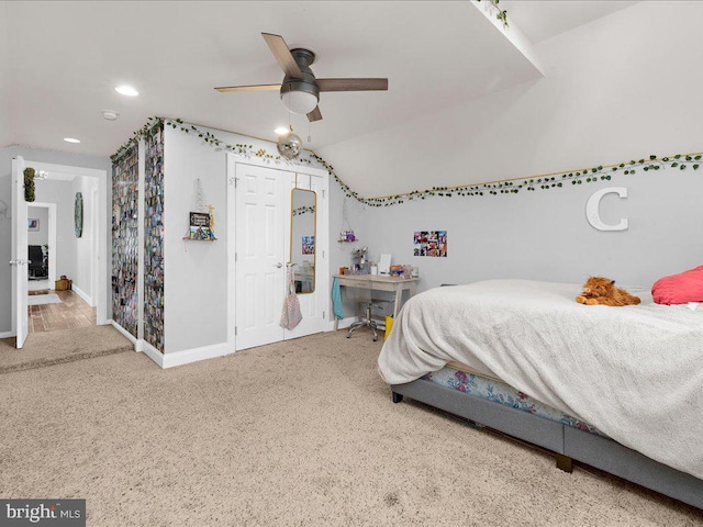 carpeted bedroom with vaulted ceiling, recessed lighting, a ceiling fan, and baseboards