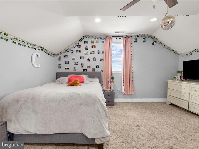 bedroom featuring lofted ceiling, light colored carpet, visible vents, a ceiling fan, and baseboards