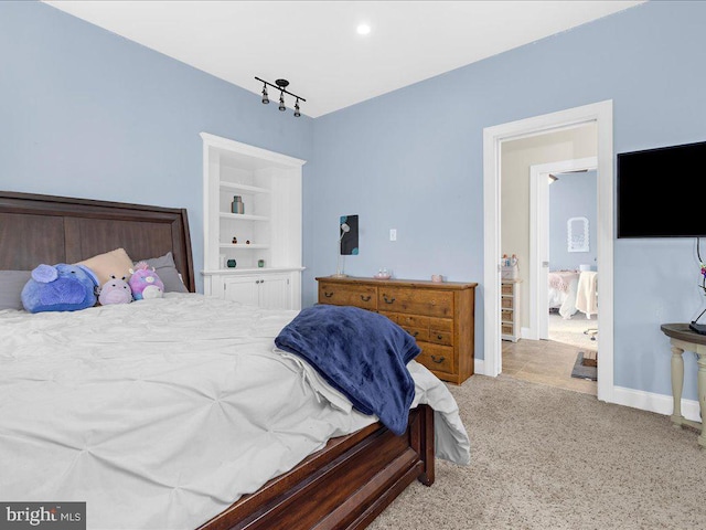 carpeted bedroom with baseboards