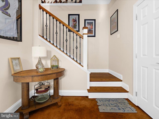 stairs featuring baseboards