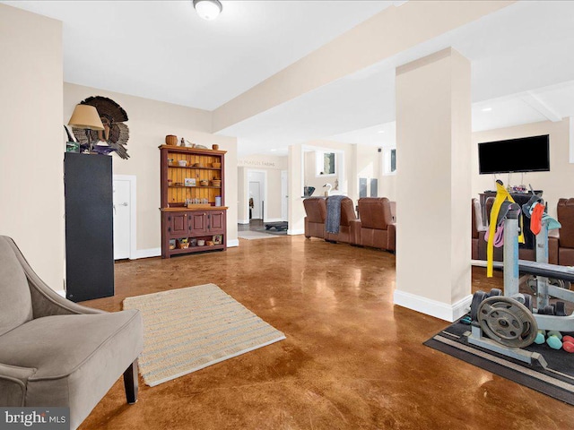 interior space with finished concrete floors and baseboards