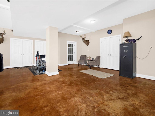 interior space featuring baseboards and finished concrete floors