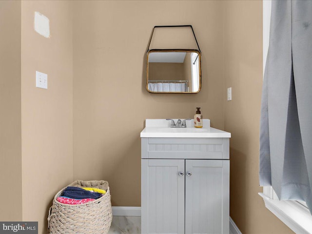 bathroom featuring vanity and baseboards