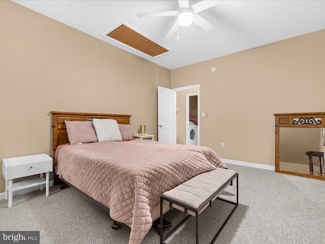 bedroom featuring washer / clothes dryer, attic access, a ceiling fan, light carpet, and baseboards