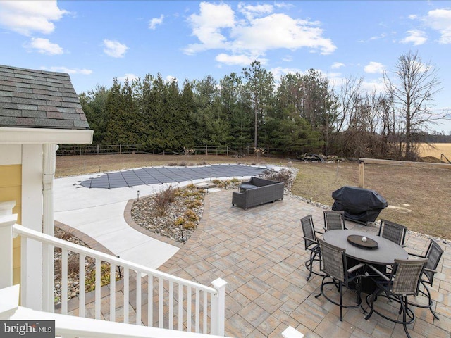 view of patio / terrace featuring outdoor dining area, fence, and grilling area