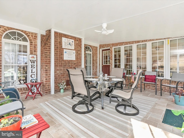 deck featuring ceiling fan and outdoor dining space