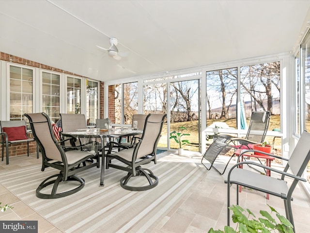 sunroom with a ceiling fan