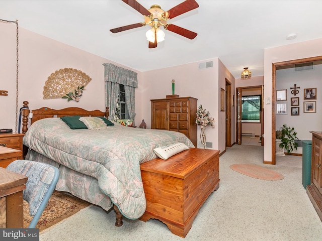 bedroom with ceiling fan and visible vents