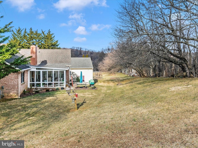 view of yard with a sunroom