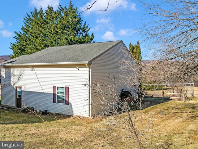 view of home's exterior featuring a lawn