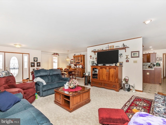 living area with light carpet