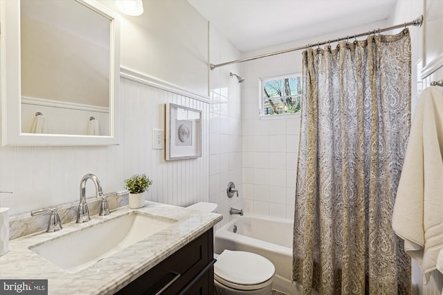 full bathroom with vanity, toilet, and shower / tub combo with curtain