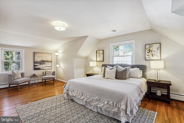 bedroom with visible vents, multiple windows, and wood finished floors