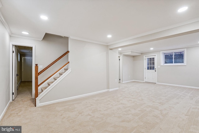 finished below grade area with recessed lighting, stairway, crown molding, baseboards, and light colored carpet