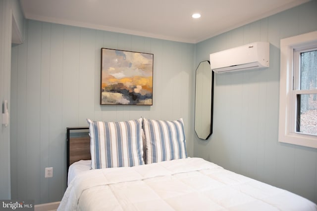 bedroom featuring an AC wall unit and recessed lighting