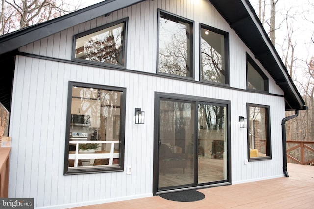 doorway to property featuring a wooden deck