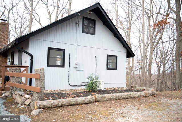 view of property exterior with a chimney