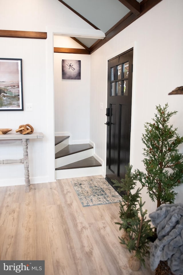 interior space featuring vaulted ceiling and wood finished floors