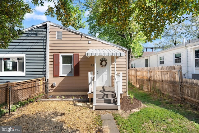 view of front of home featuring fence private yard