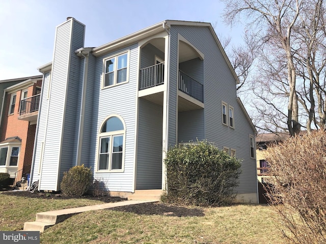 view of home's exterior featuring a chimney