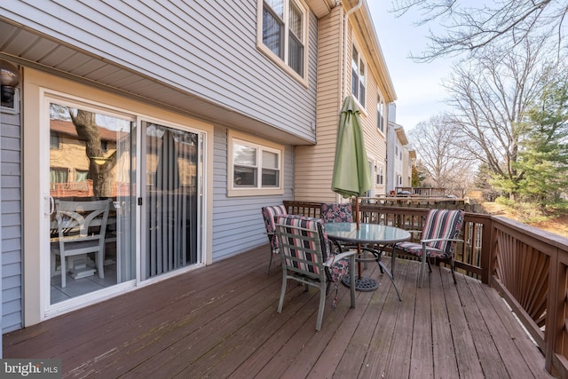 wooden deck with outdoor dining area