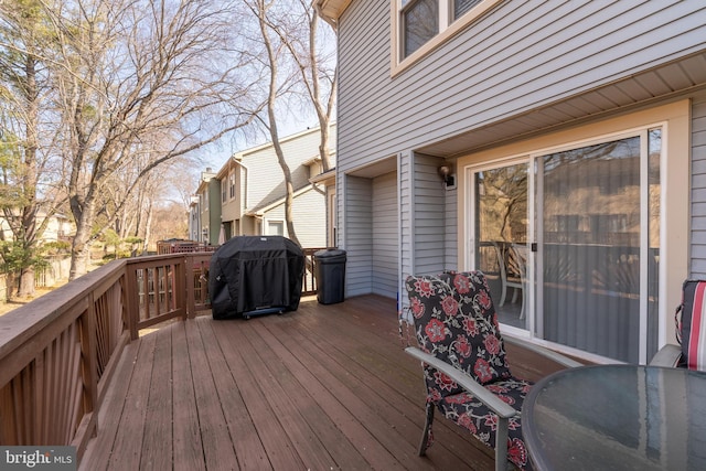 wooden deck featuring area for grilling