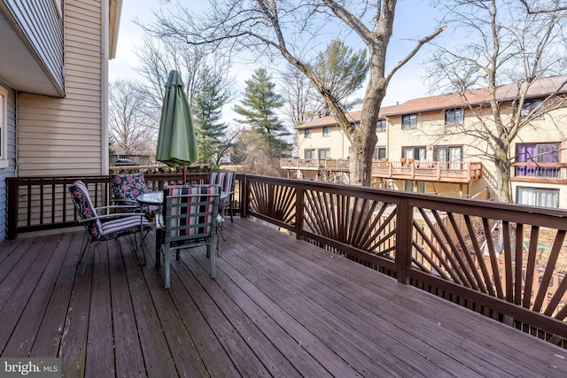 wooden terrace featuring a residential view