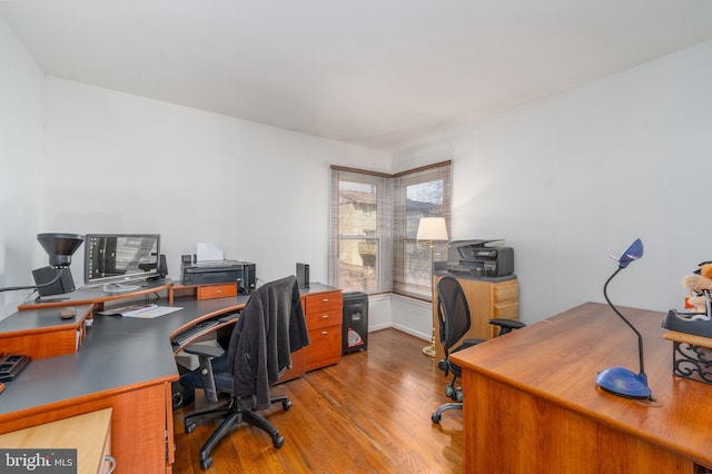 home office with wood finished floors