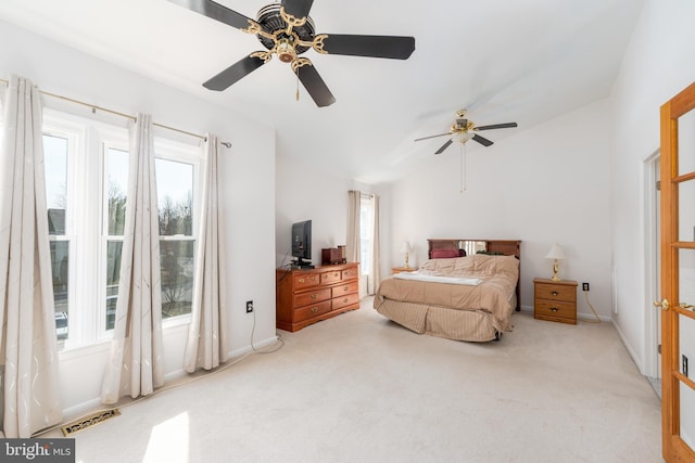 bedroom with carpet floors, visible vents, and a ceiling fan