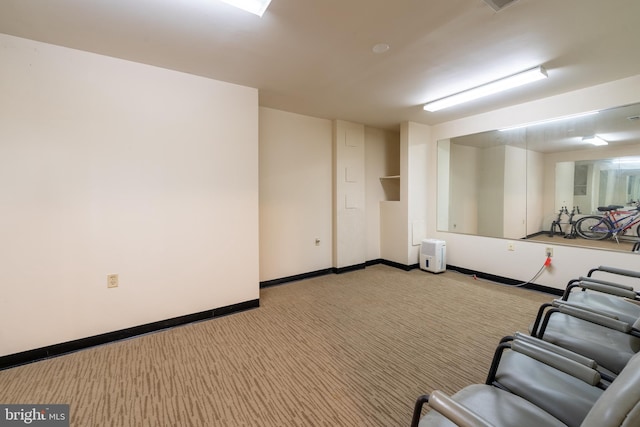 interior space with carpet flooring and baseboards