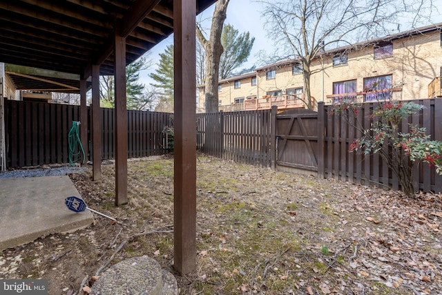 view of yard featuring a gate and a fenced backyard