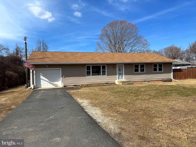 single story home featuring a front yard, driveway, an attached garage, and fence