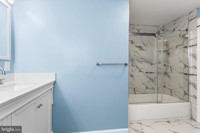 full bathroom with marble finish floor, shower / bath combination with glass door, and vanity