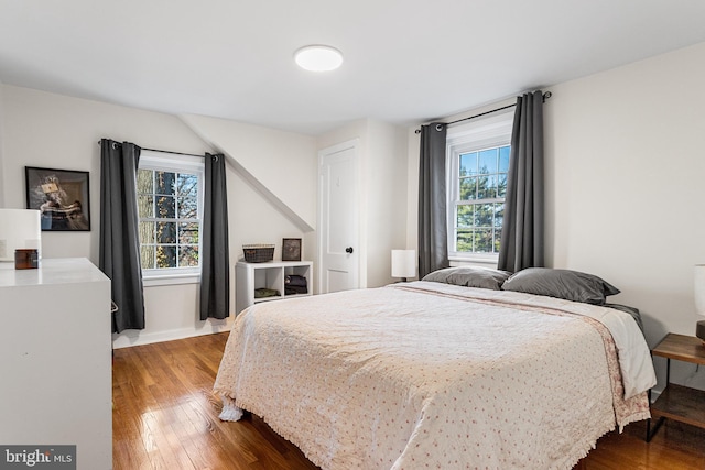 bedroom featuring wood-type flooring