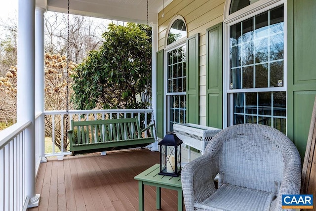 wooden terrace with a porch