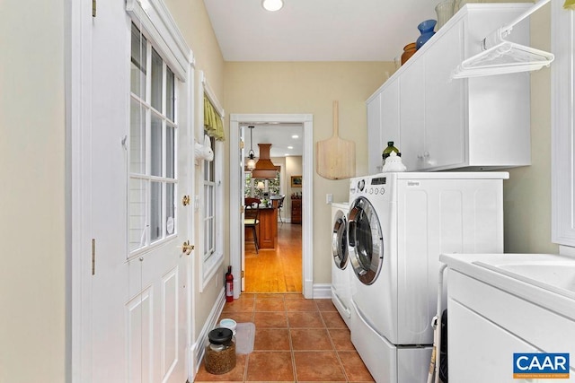 laundry area featuring baseboards, washing machine and clothes dryer, recessed lighting, cabinet space, and tile patterned floors