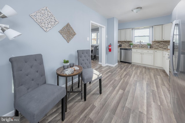 sitting room featuring light wood-style floors and baseboards