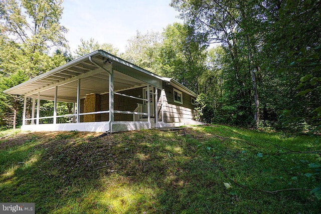 view of home's exterior featuring a sunroom