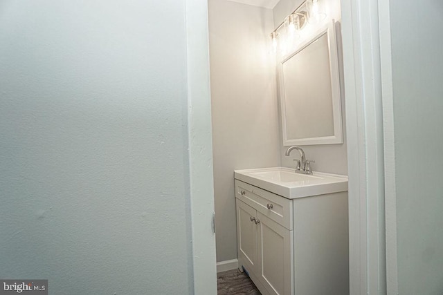 bathroom featuring vanity and baseboards