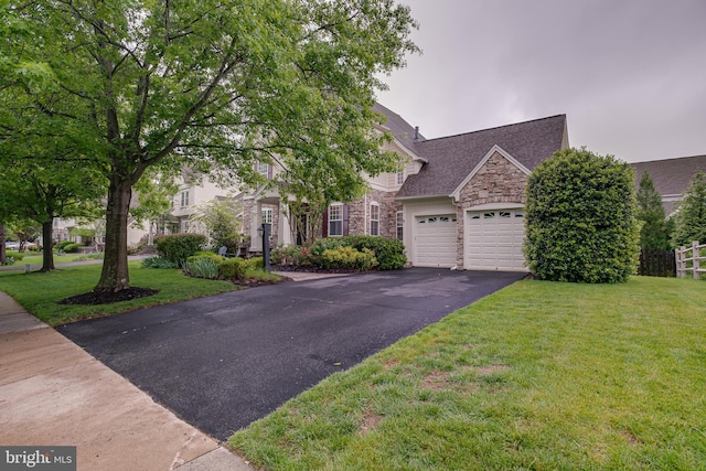 6735 Eckert Ct, Warrenton, VA 20187 - view of front of property featuring stone siding, asphalt driveway, a garage, and a front yard