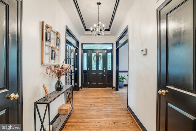 6735 Eckert Ct, Warrenton, VA 20187 - entrance foyer with a chandelier, light wood-type flooring, and baseboards