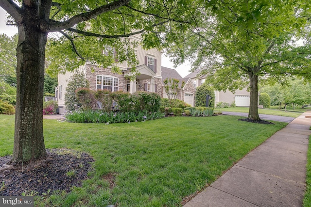 6735 Eckert Ct, Warrenton, VA 20187 - view of front of home with stone siding, a front lawn, and a garage