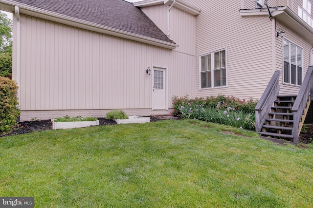 6735 Eckert Ct, Warrenton, VA 20187 - back of house with a shingled roof, a lawn, and stairway