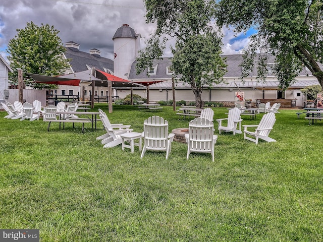 6735 Eckert Ct, Warrenton, VA 20187 - view of grassy yard with an outdoor fire pit