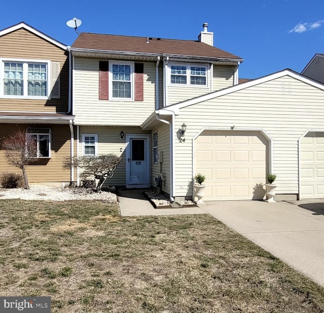 multi unit property featuring driveway and a chimney