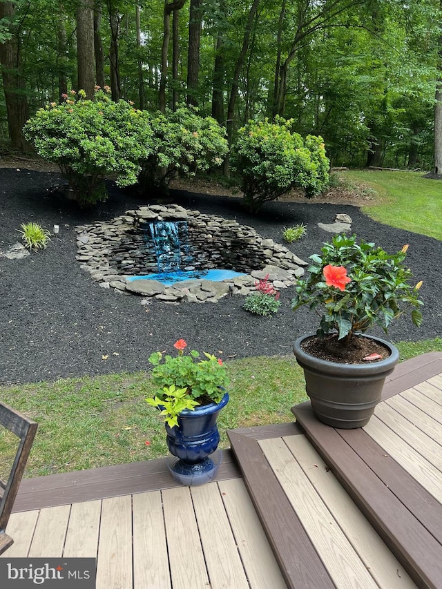 view of yard with a wooden deck