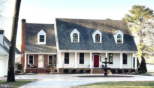 cape cod house with brick siding