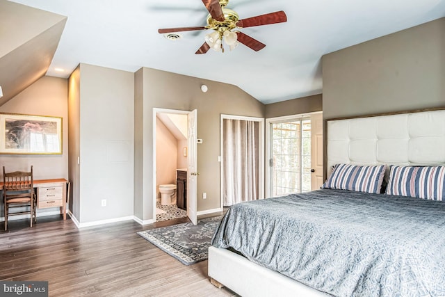 bedroom featuring connected bathroom, baseboards, wood finished floors, and vaulted ceiling