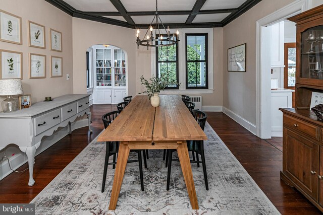 dining area featuring baseboards, radiator heating unit, arched walkways, coffered ceiling, and dark wood-style flooring