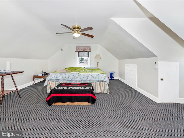 bedroom featuring lofted ceiling, carpet, and baseboards